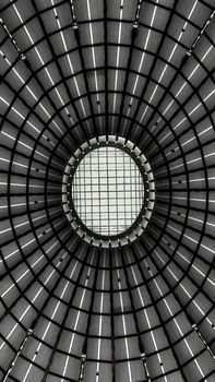 Circular glass ceiling showcasing symmetry and geometry, captured in Frankfurt, Germany.