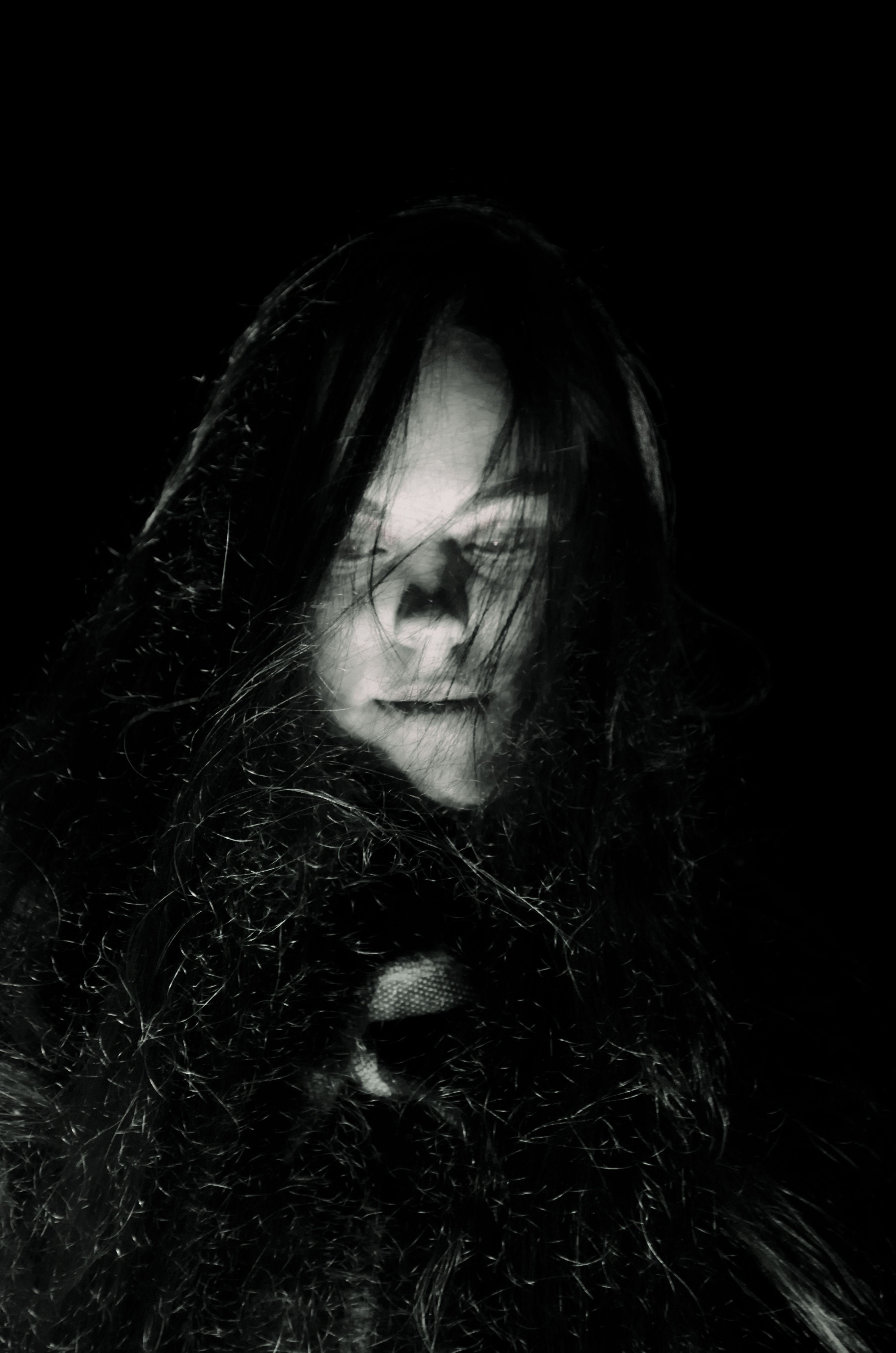 Black and White Photo of a Young Woman Standing in the Dark · Free ...