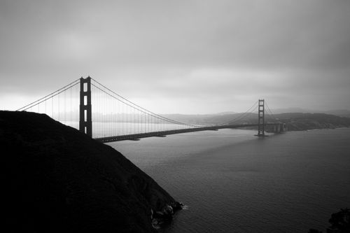 Free Dramatic black and white aerial view of Golden Gate Bridge in San Francisco. Stock Photo