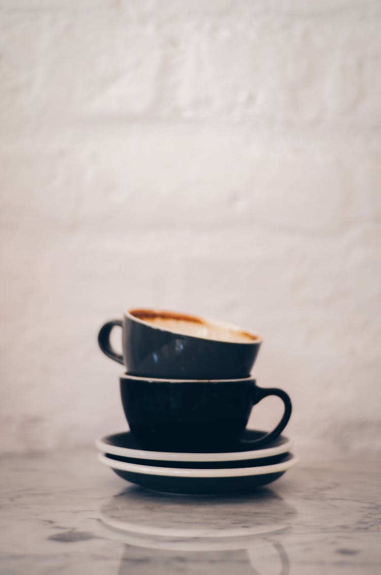 Two Black Ceramic Teacups