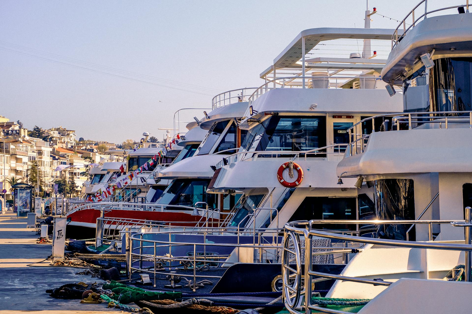 Explore luxury motor yachts docked at a vibrant marina in Istanbul, Turkey.