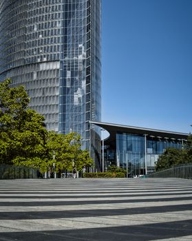 View of the iconic Post Tower against a clear blue sky in Bonn, Germany.