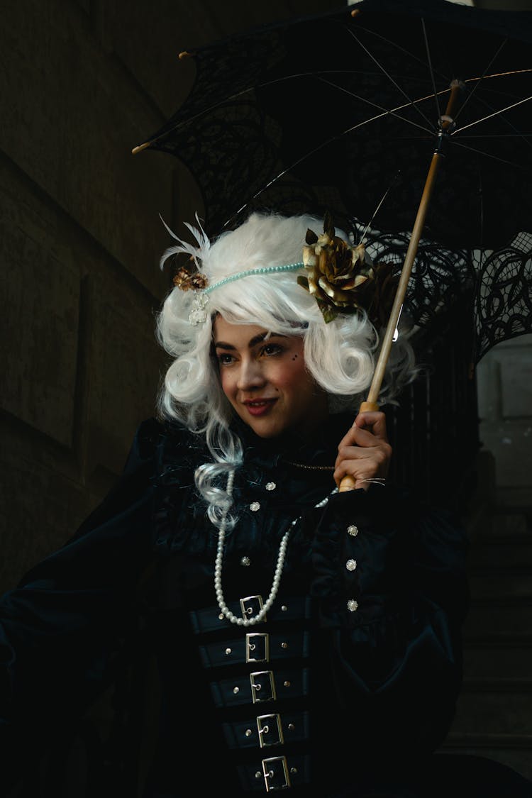 Portrait Of A Woman In A Costume With An Umbrella