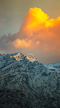 Scenic view of snowcapped mountains illuminated by sunset light in Duhok, Kurdistan Region, Iraq.