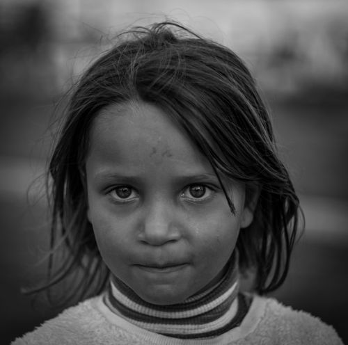 Free Expressive black and white portrait of a thoughtful young girl outdoors. Stock Photo