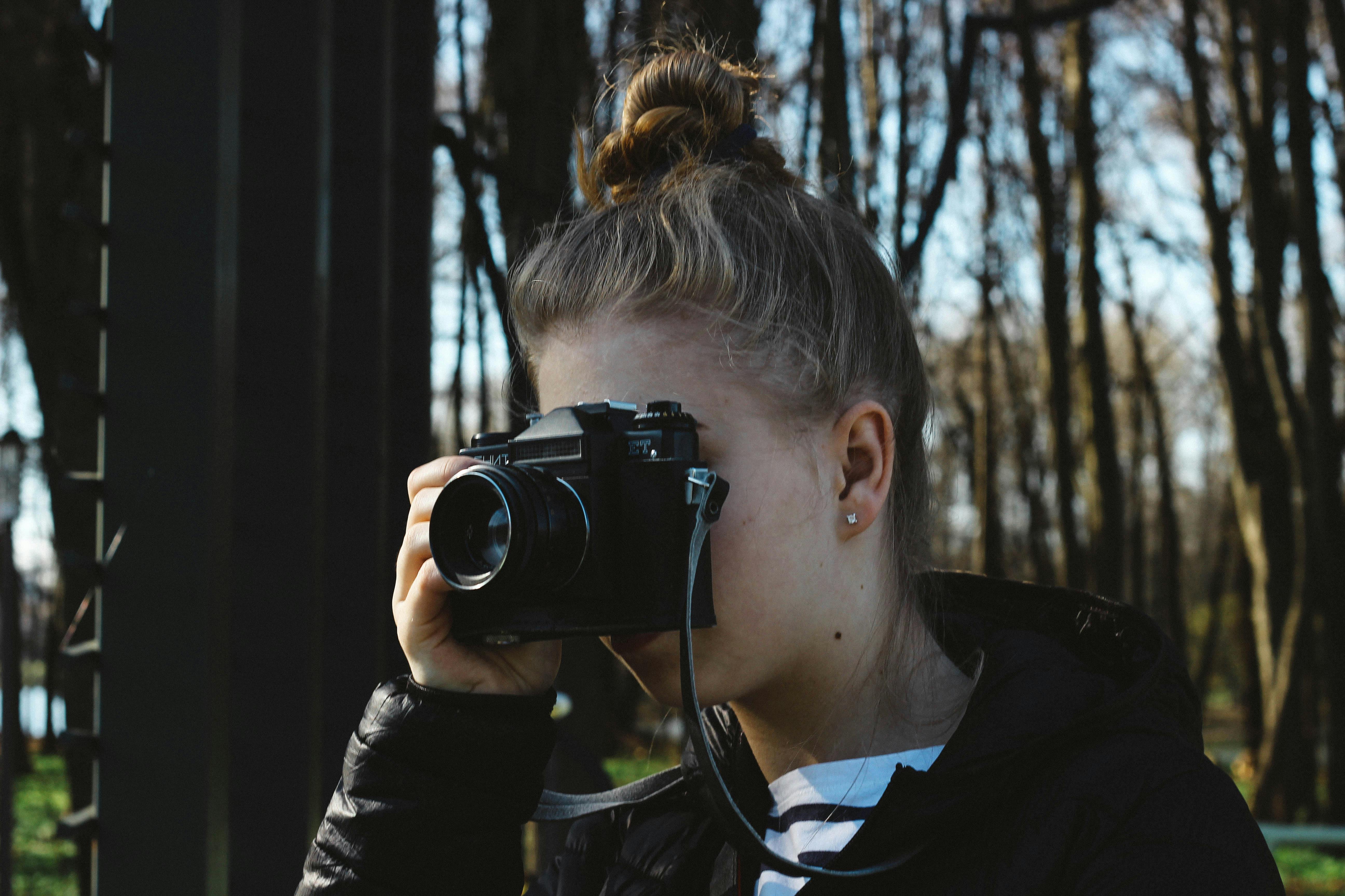 Woman Using Film Camera · Free Stock Photo