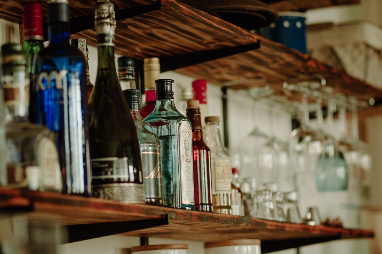 Home bar cabinetry with back-bar shelving