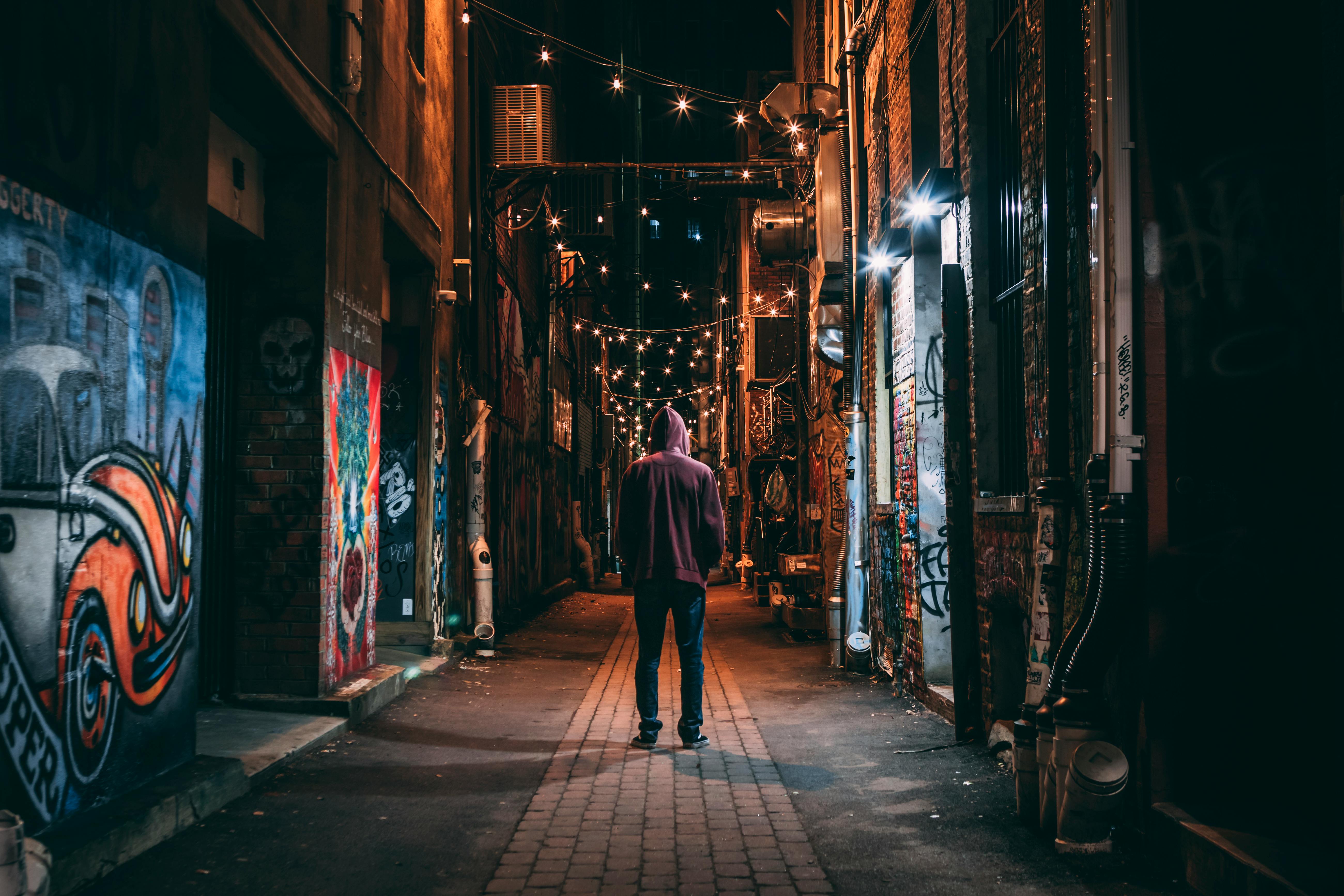 man standing on brown pathway