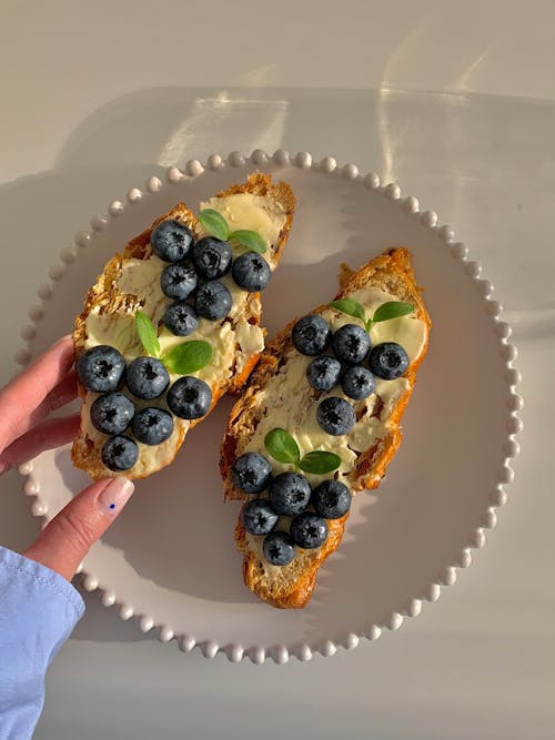 Eating Slices of Bread with Blueberries