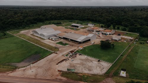 Aerial view of a large farm with a large building