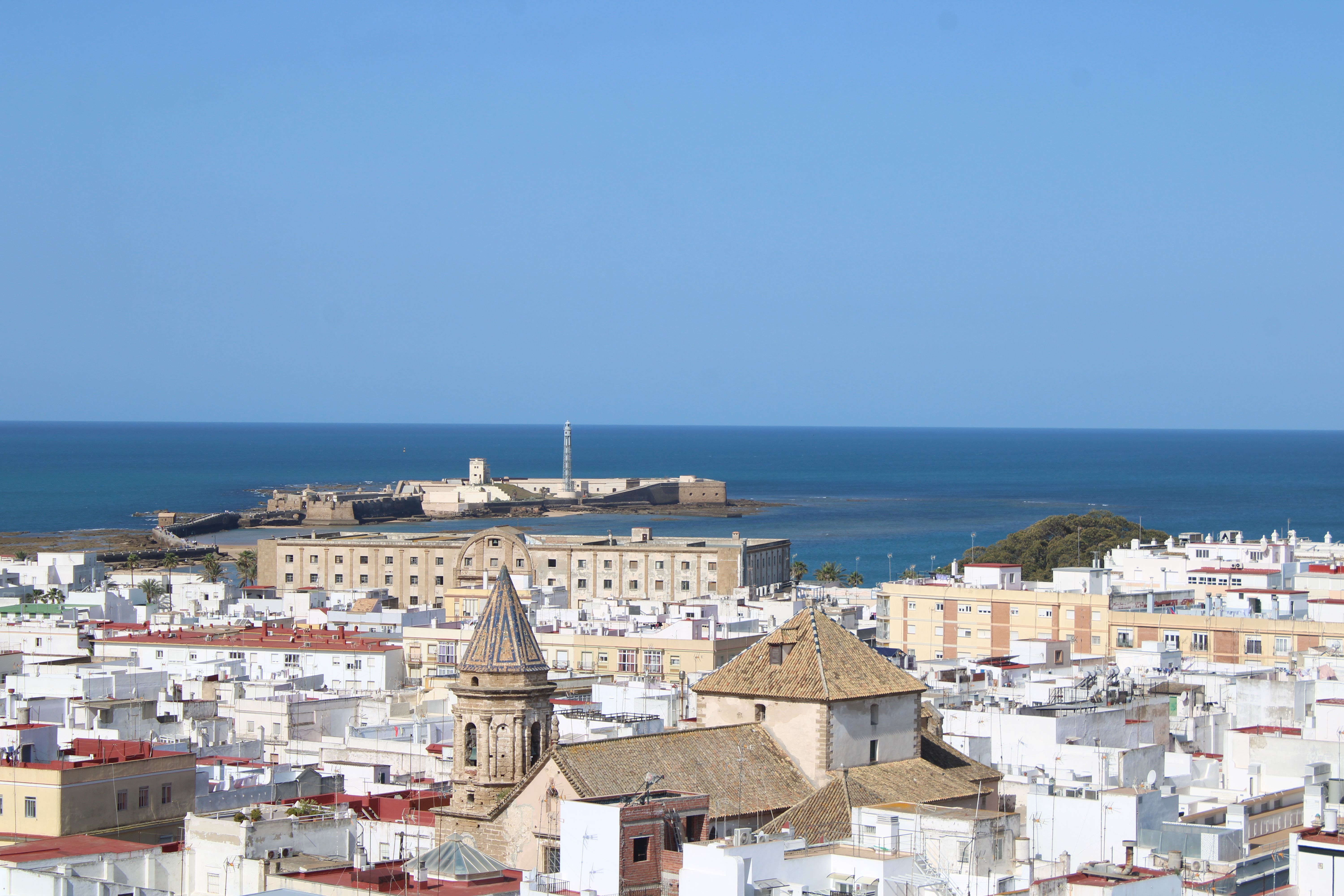 A stunning view of Cádiz showcasing its urban landscape against the vast ocean backdrop.