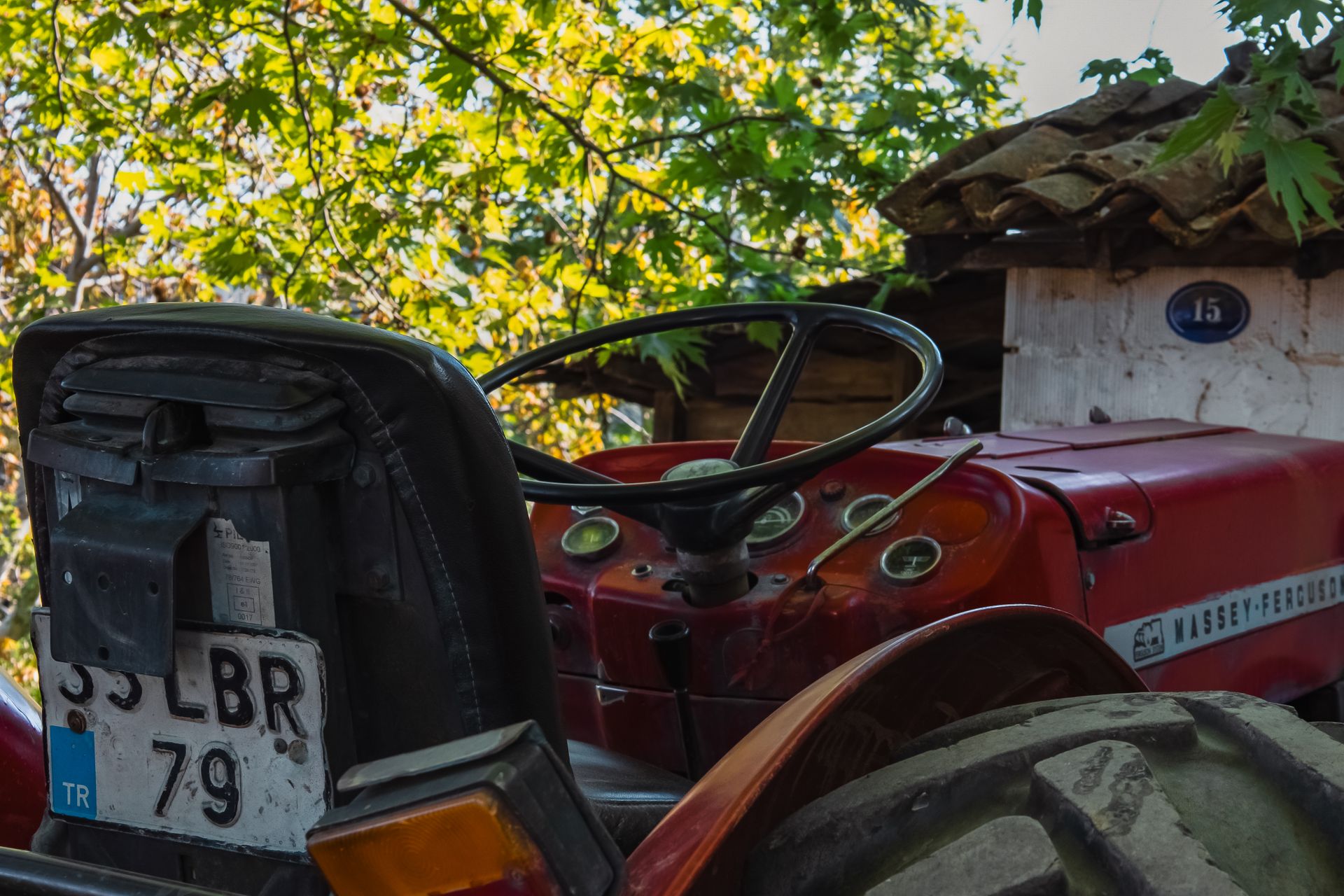 Seat and Steering Wheel of a Red Tractor