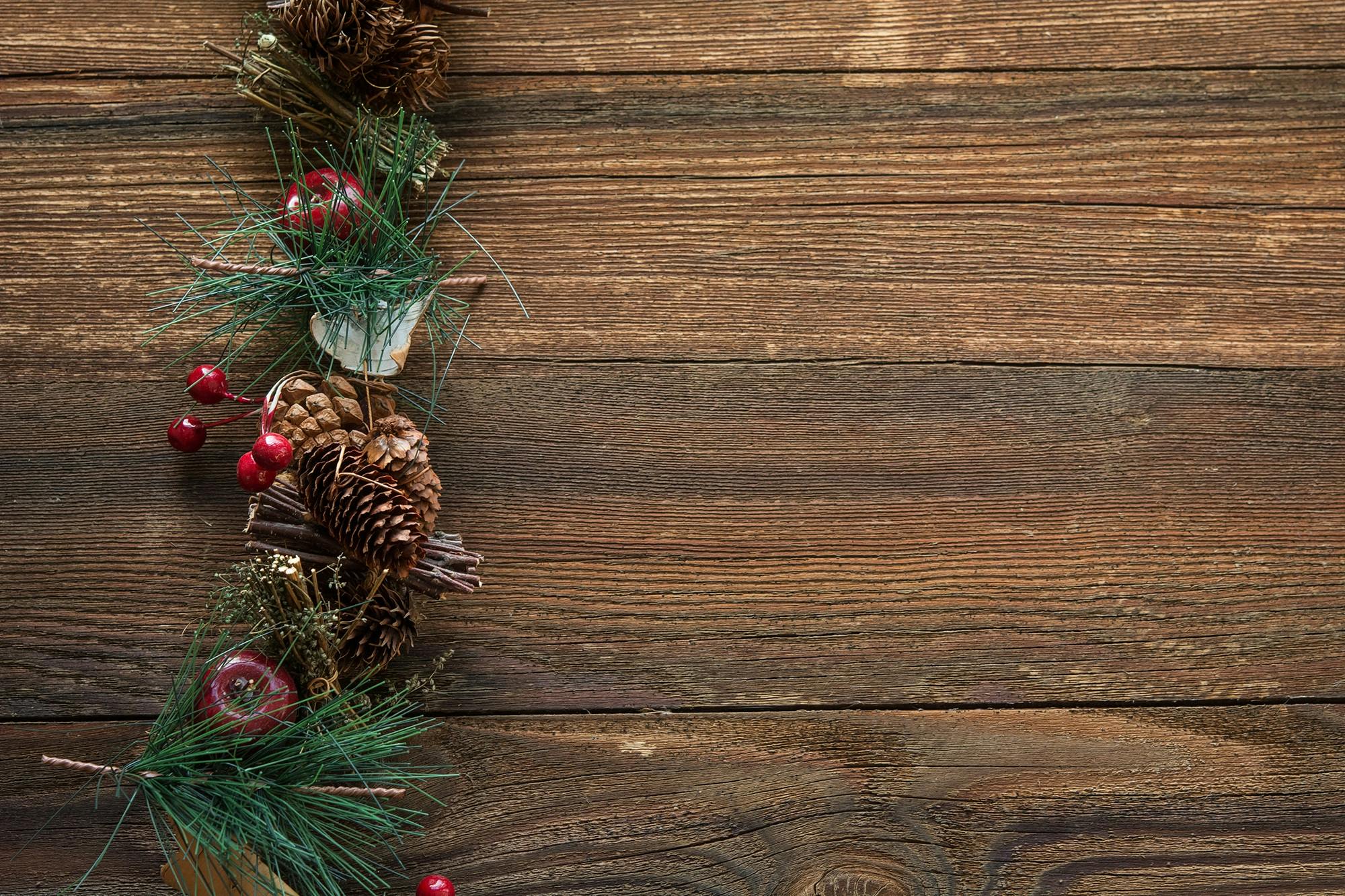 Christmas Wallpaper With Small Spruce Cones And Christmas Lights Mini Pine  Cones On The Wooden Backdrop Stock Photo - Download Image Now - iStock