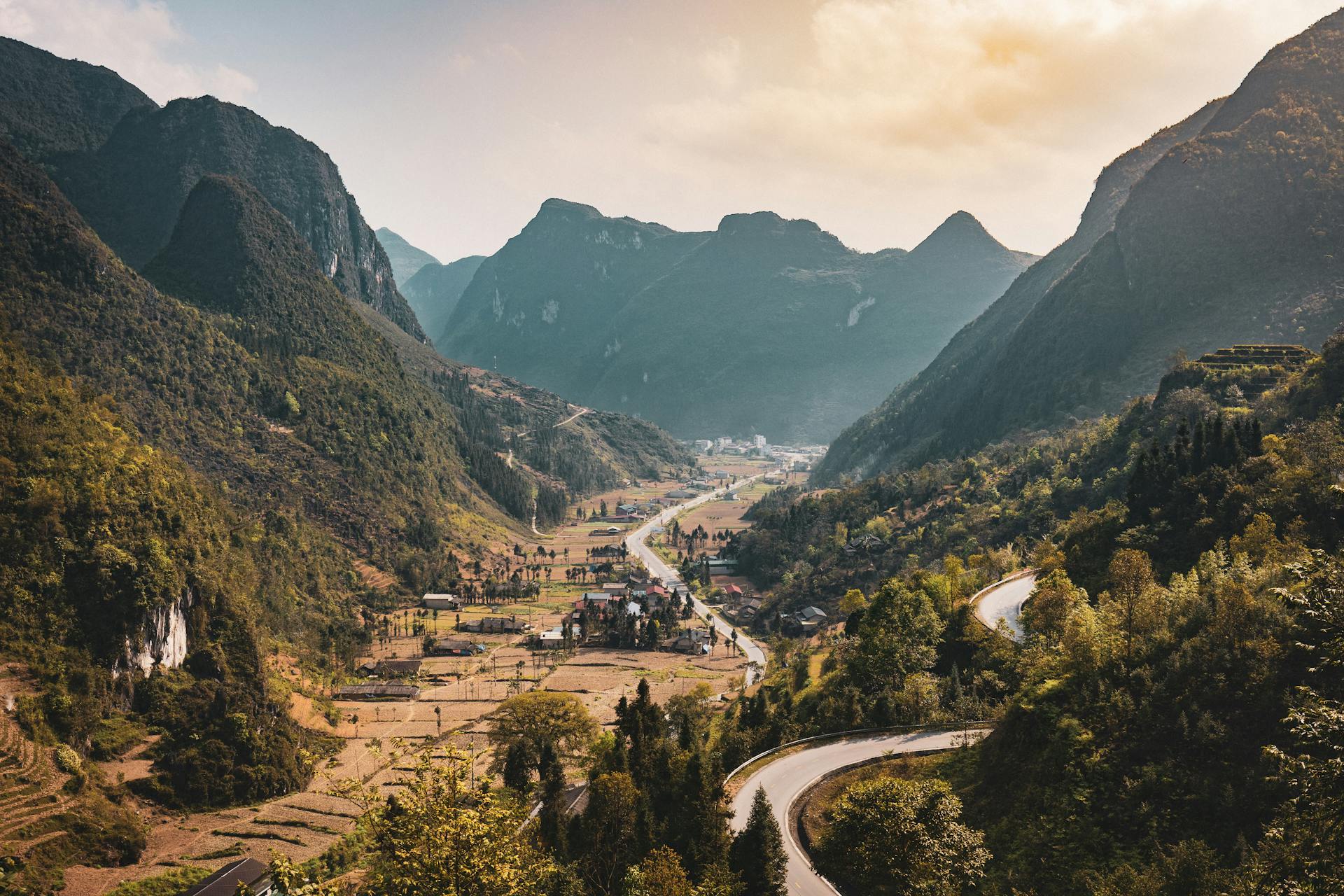 Village and Forest in Valley in Mountains