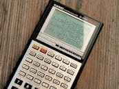 Scientific Calculator on Wooden Surface