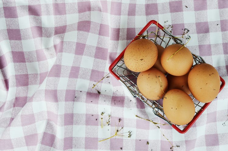 Top View Photo Of Brown Eggs In Basket