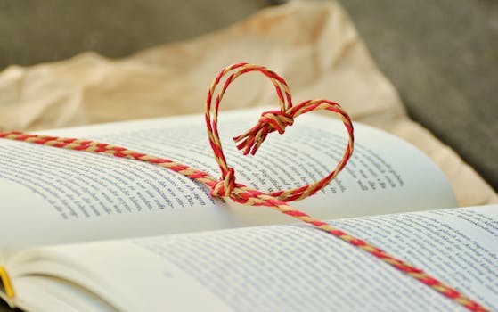 Yellow and Red Heart Knot on Black Labeled Book