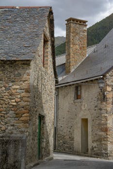 Quaint stone houses in Sallent de Gállego, Spain, capture a vintage European charm.
