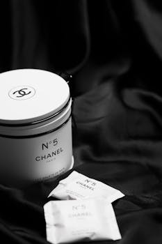 Luxurious Chanel No.5 bath tablets elegantly displayed on black satin, symbolizing opulence and sophistication.