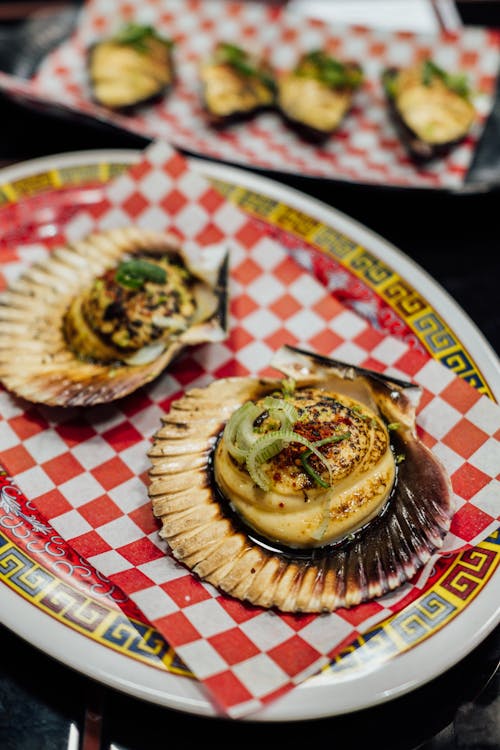 A plate with two scallops on it