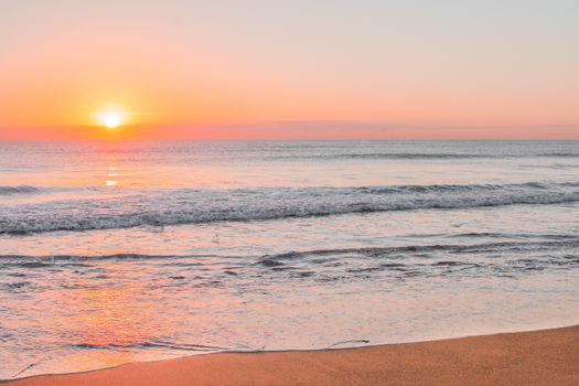 Beautiful view of the sunset over rolling waves at Marbella beach, capturing tranquility and nature's beauty.