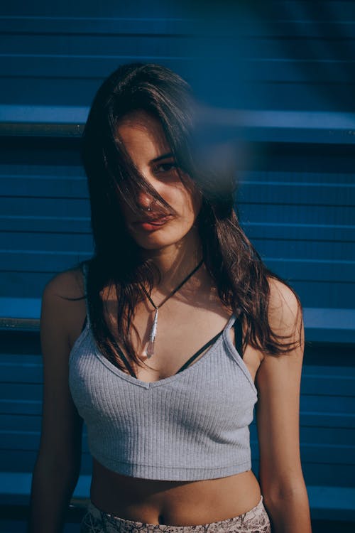 Woman Standing Beside Wall