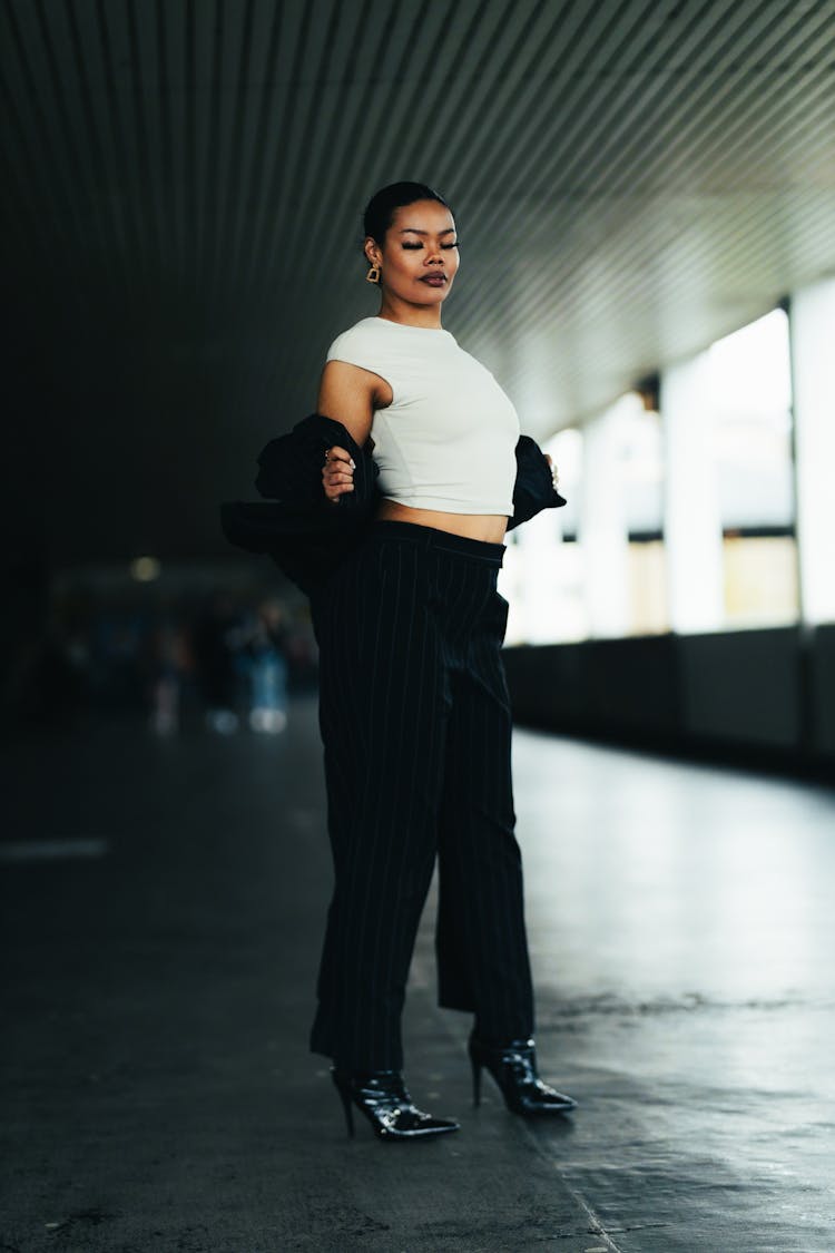 Model In Striped Pants And Heels