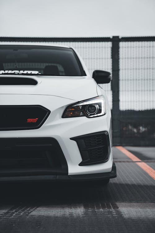 The front end of a white subaruna