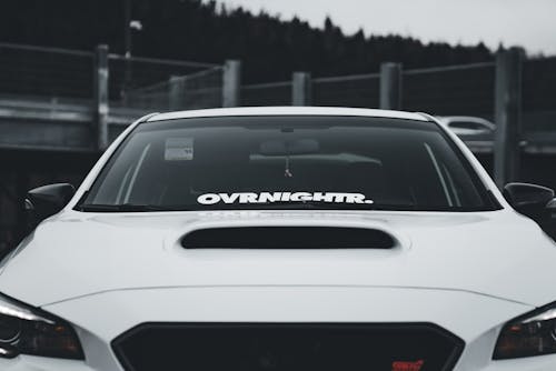 A white car with the word overdrive on it