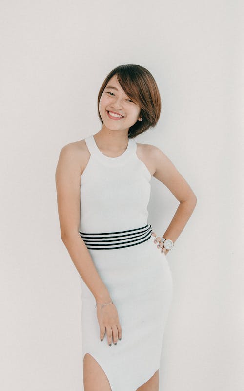 Smiling Model in White Dress