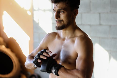 Topless Man With Black Ufc Fingerless Gloves