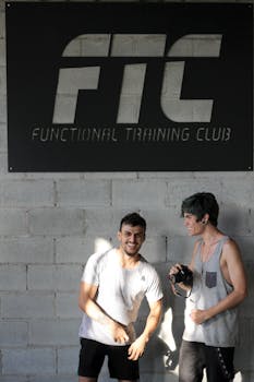Two young men enjoying a moment at a functional training club.