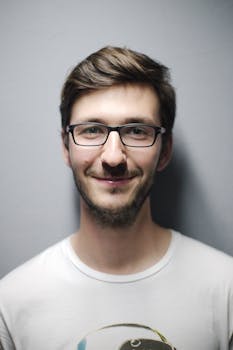 Man Smiling Behind Wall