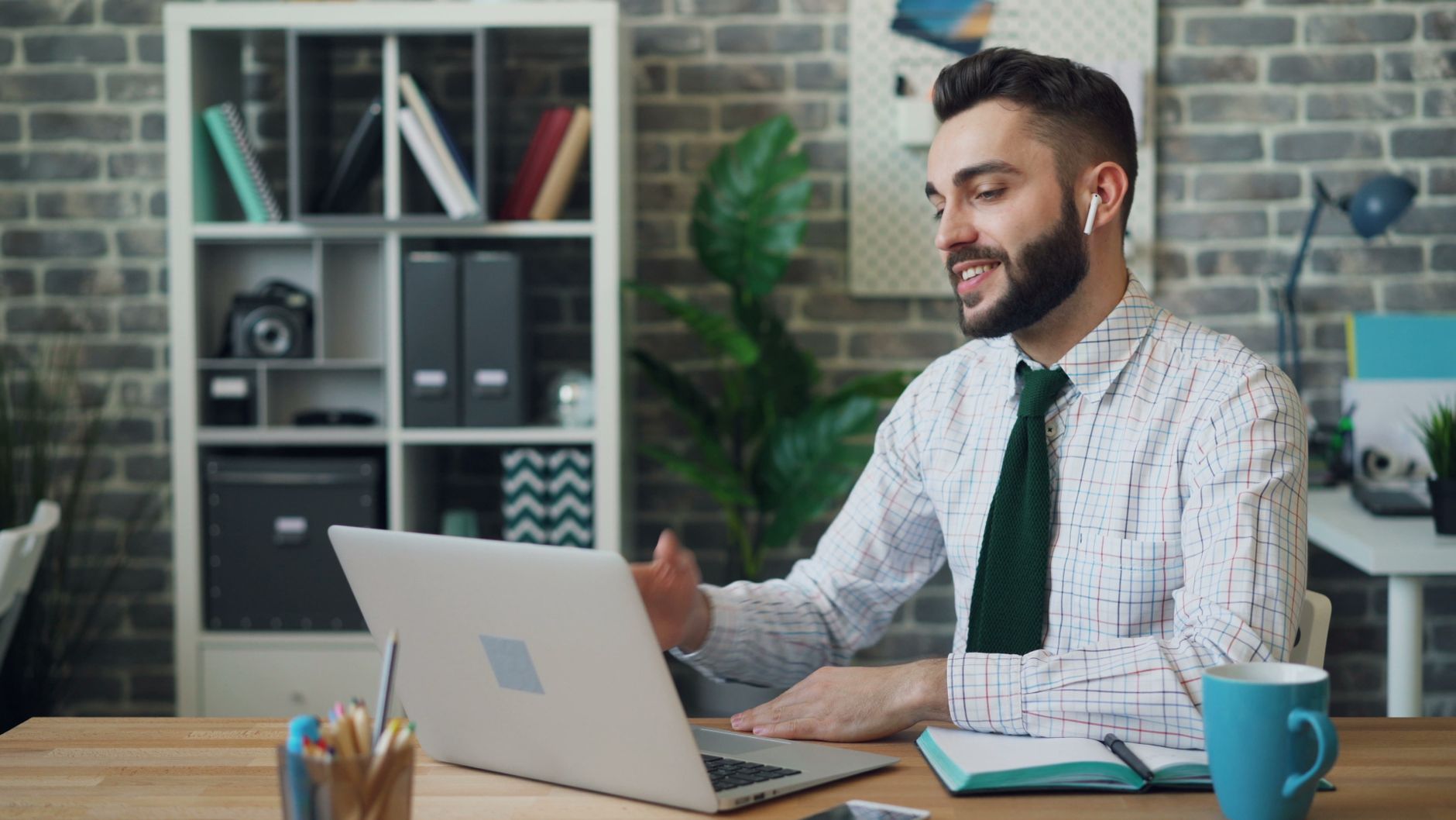 Indian professional studying online MBA on laptop, focused and engaged