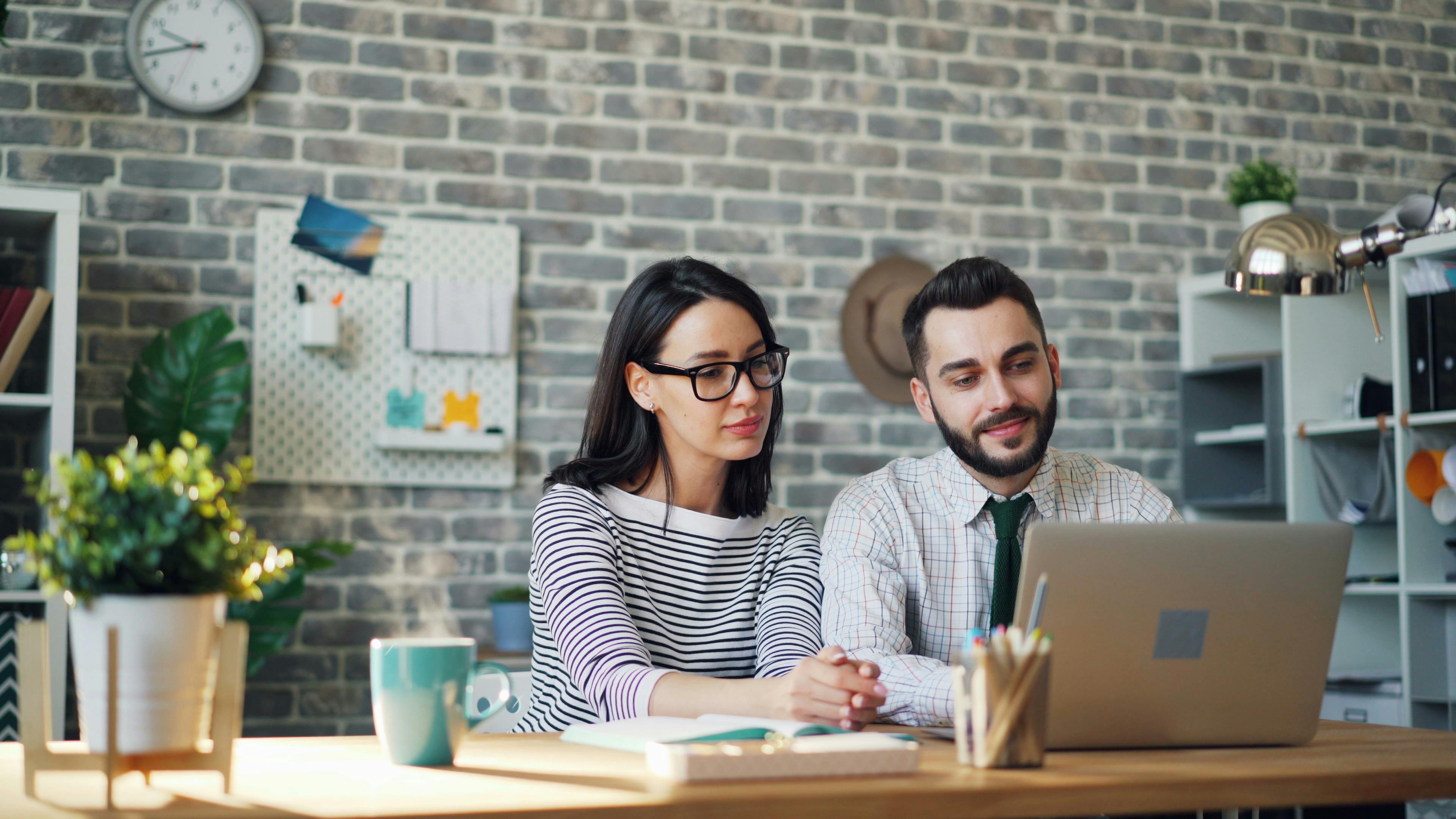 Man and Woman Sitting in Office · Free Stock Photo