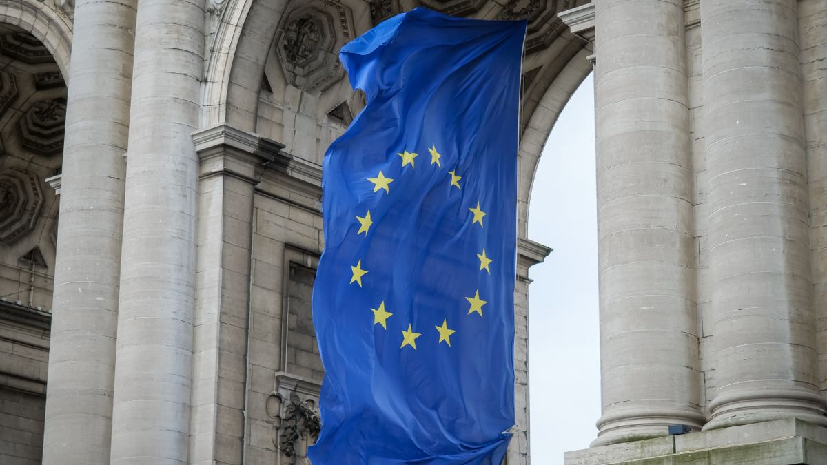 The European Union flag flying beneath the Cinquantenaire Arch in Brussels
