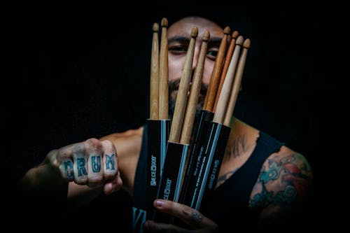 Man Holding Drum Sticks