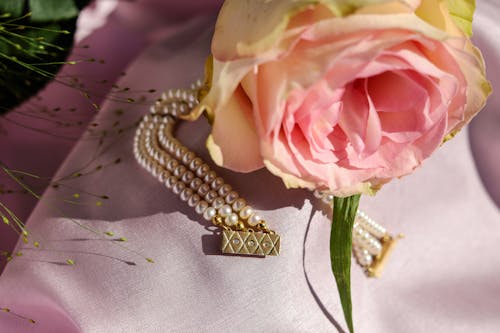 Free Pink Rose and Gold Beaded Jewelry Stock Photo