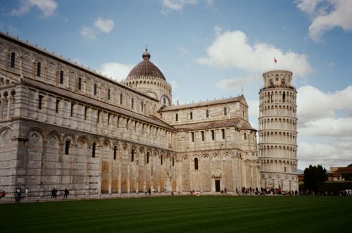 Free View of the Leaning Tower of Pisa and Pisa Cathedral in Italy's Piazza dei Miracoli. Stock Photo