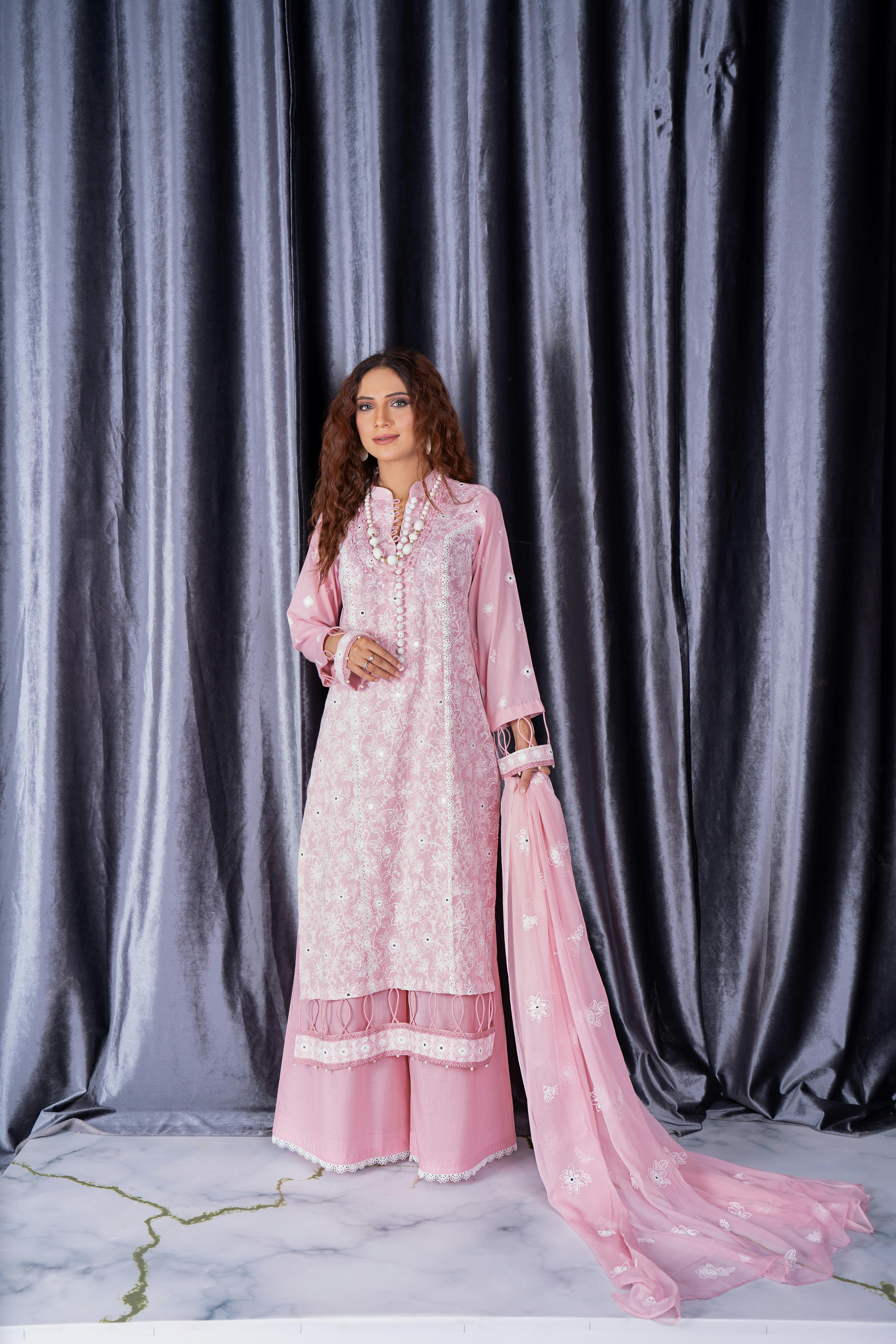 model in embellished pink kurta posing with scarf