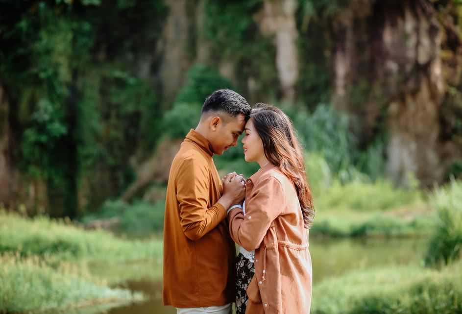 mature couple using dating app on tablet