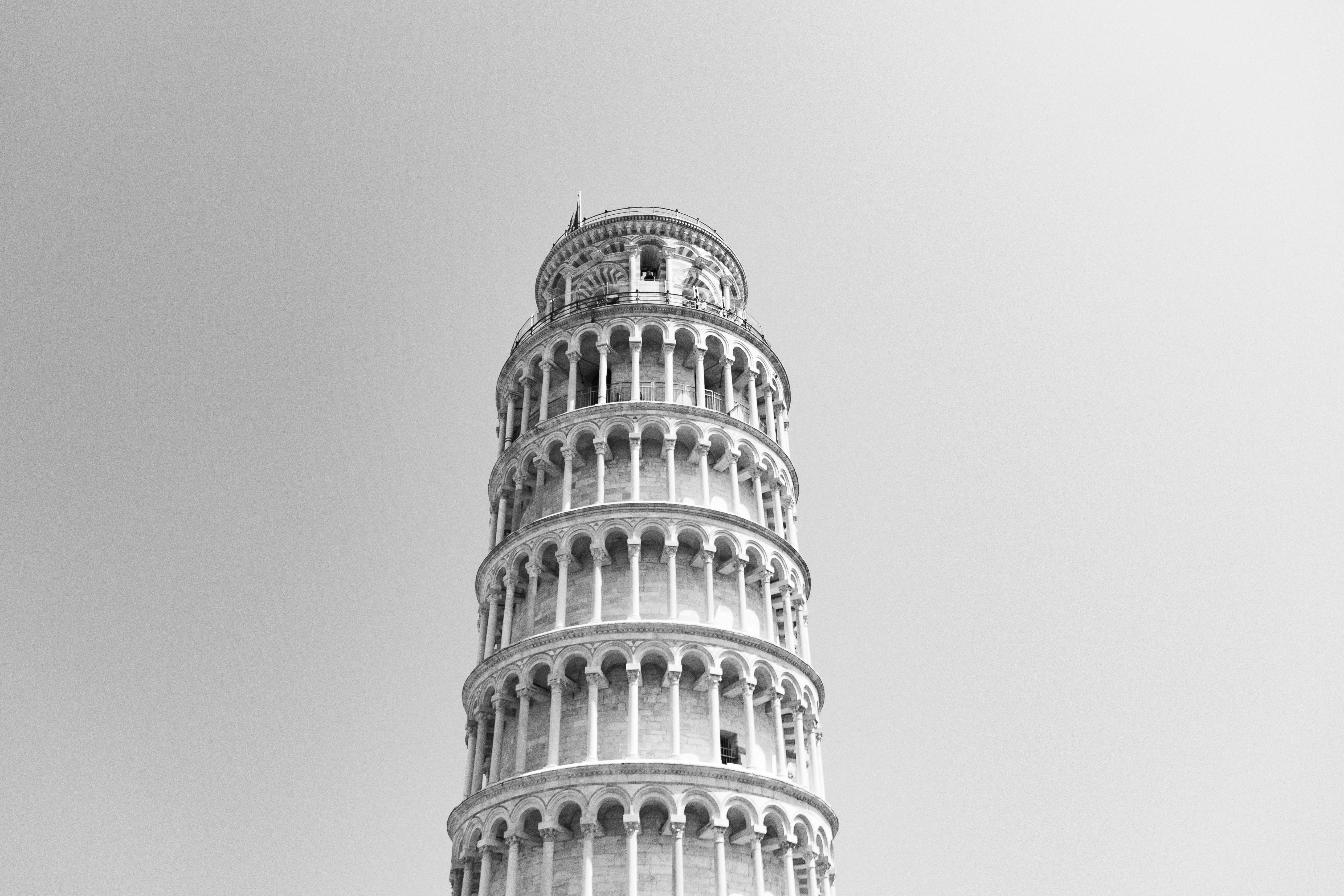 Monochrome photograph of the Leaning Tower of Pisa, Italy's renowned landmark.