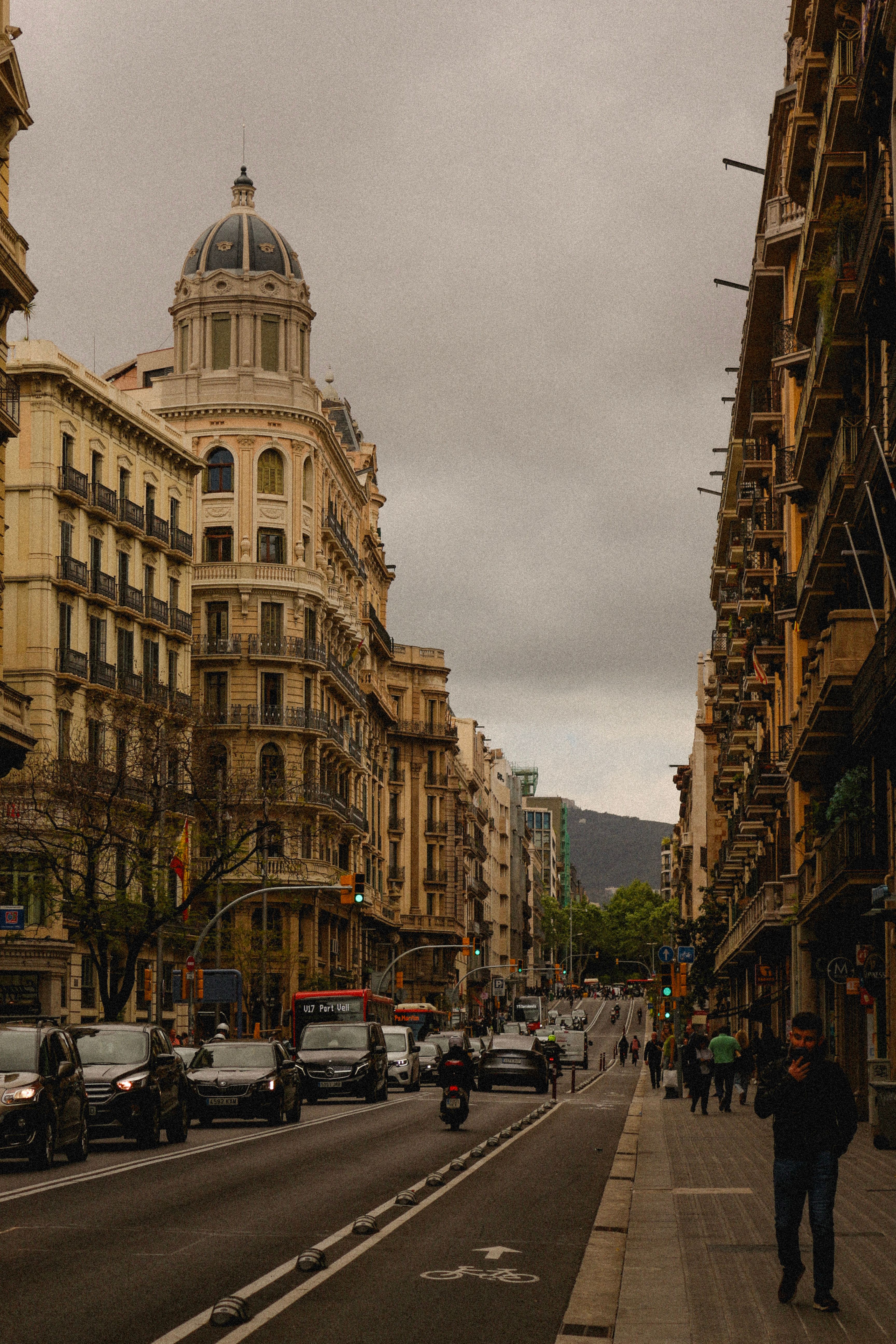 A tourist looking at a map in the Gothic Quarter, illustrating effective Barcelona travel tips.