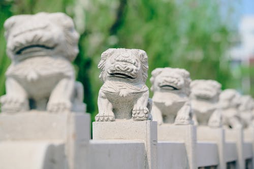 A row of stone statues of chinese lions