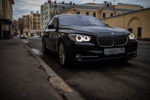 Bmw 7 series sedan parked on the street in a city