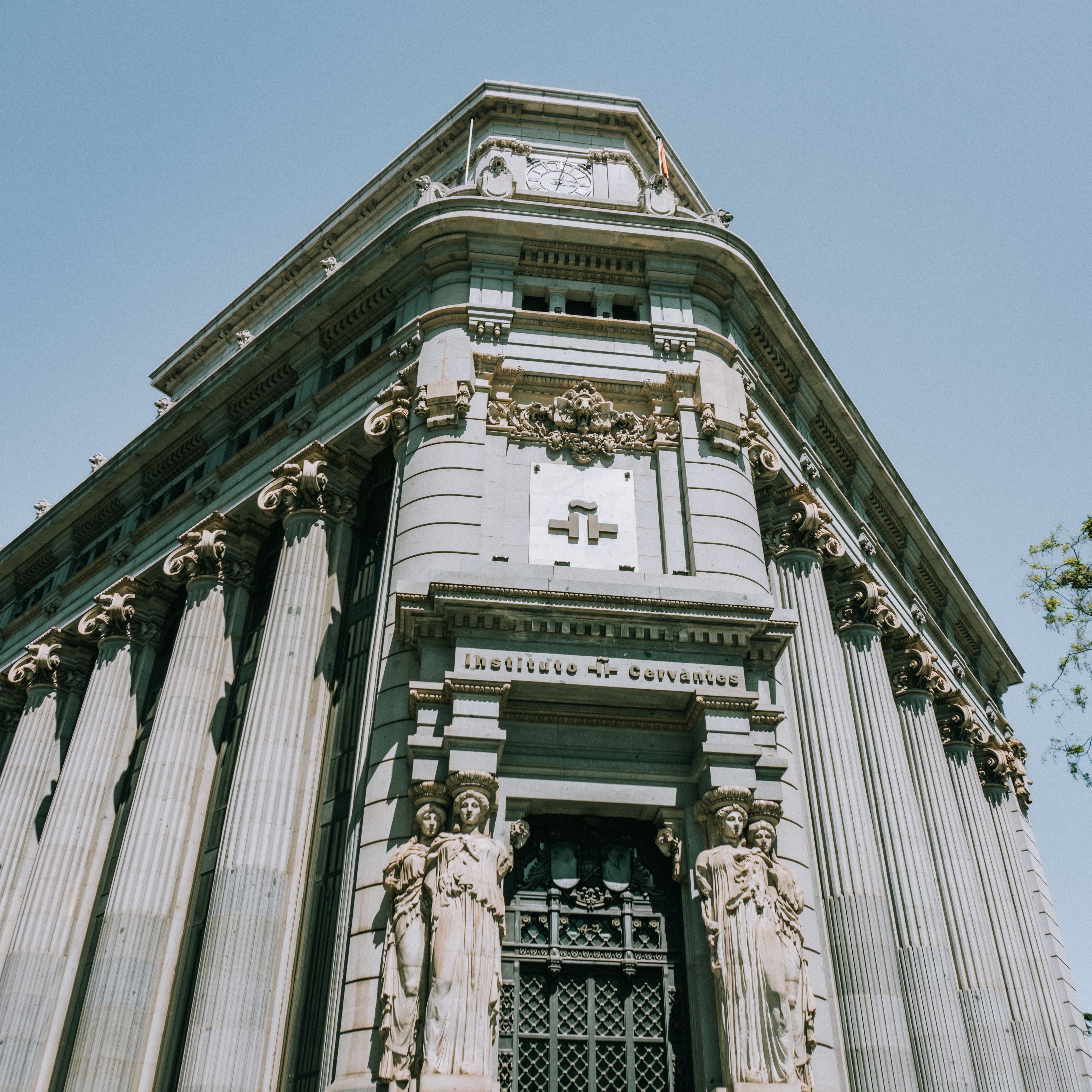 Majestic facade of Instituto Cervantes, showcasing classic architectural details in Madrid.