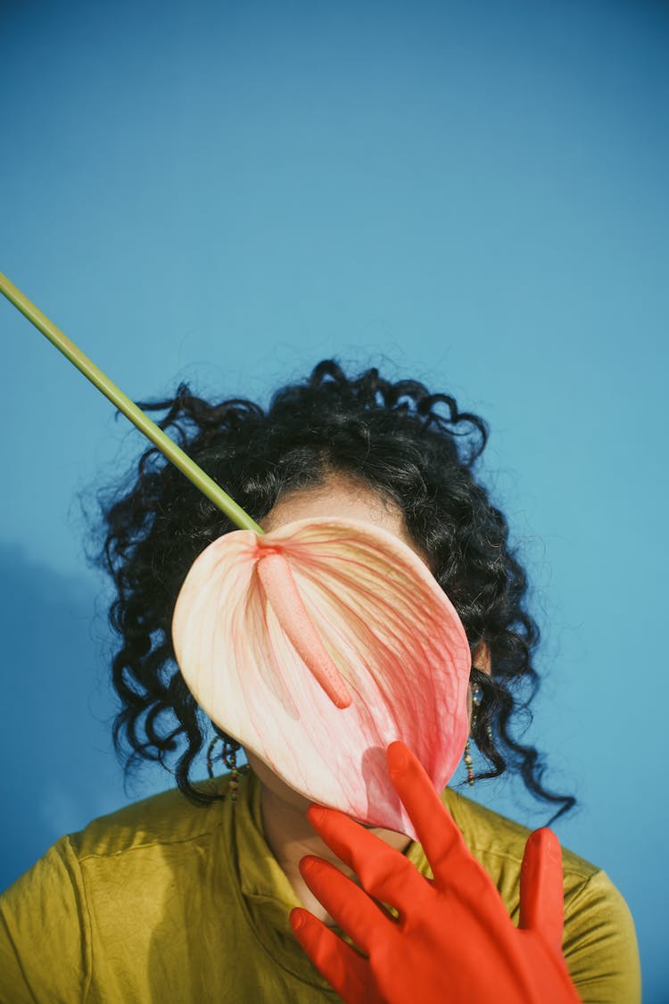 Woman With Plant Leaf Over Face