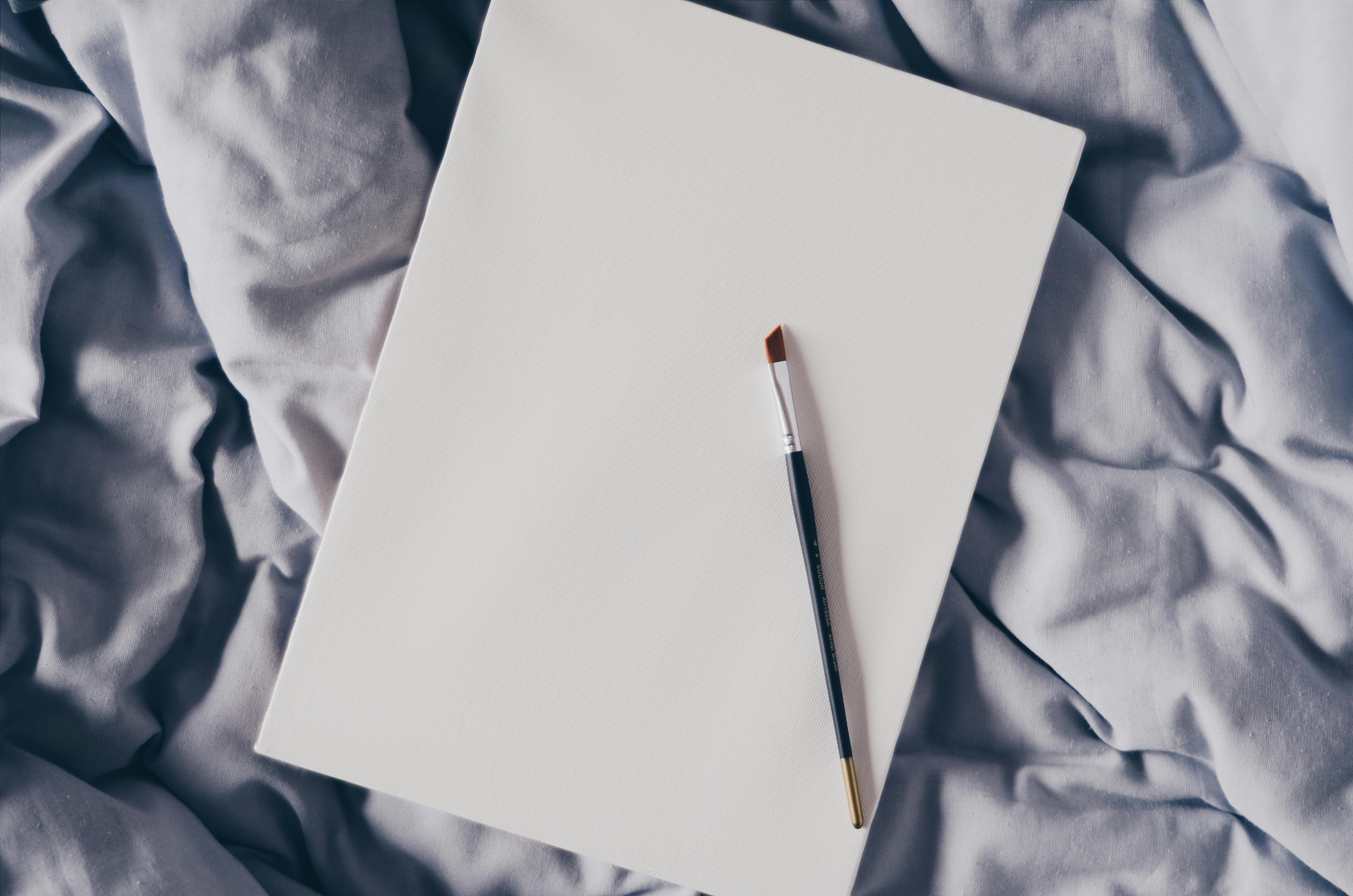 Black Painting Brush On White Paper Free Stock Photo