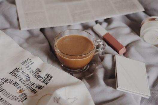 A warm coffee scene with newspapers, perfect for a cozy morning routine at home.