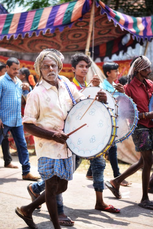 Free Man Playing Percussion Instrument at Parade Stock Photo